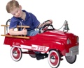 Boy with toy firetruck