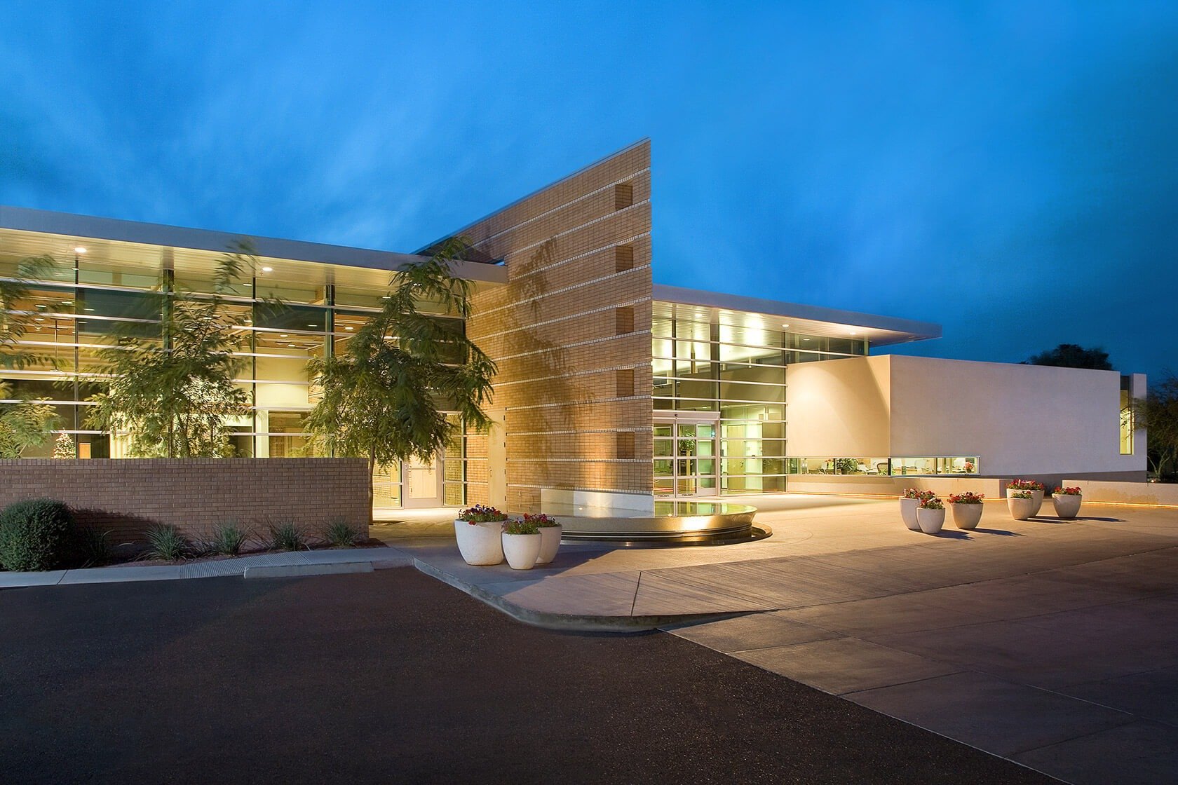 Granite Reef Senior Center - image of a large building made of brick and glass with several plant pots in front