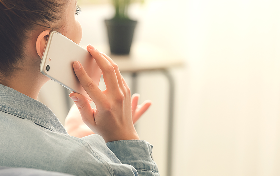 Female holding mobile phone to ear