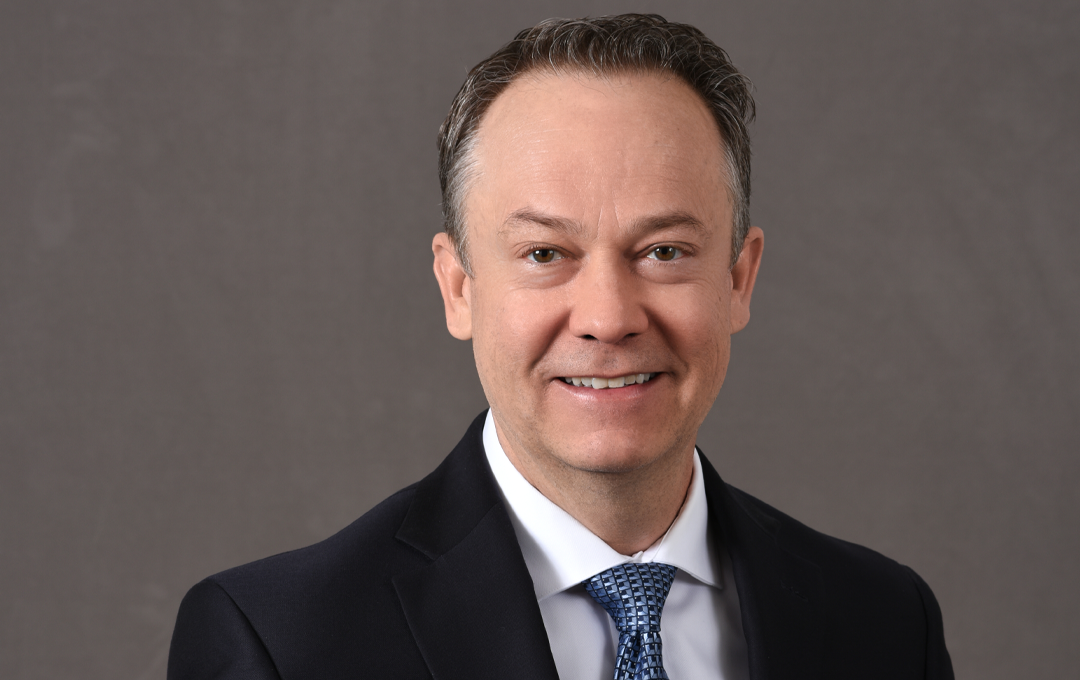 News image Man in suit smiling
